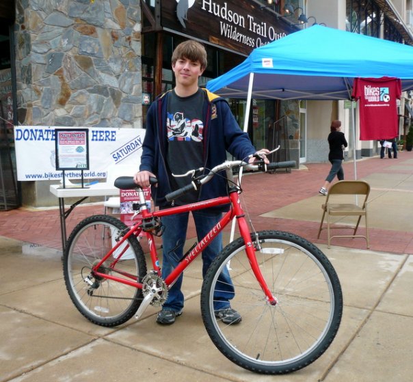 Person holding a bike