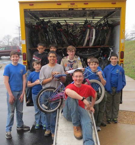 Boy scouts at a bike collection event