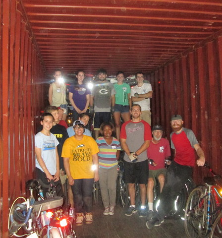 Volunteers in a loading container