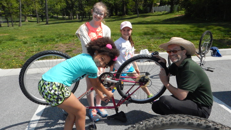Elementary school students helping with bike organization